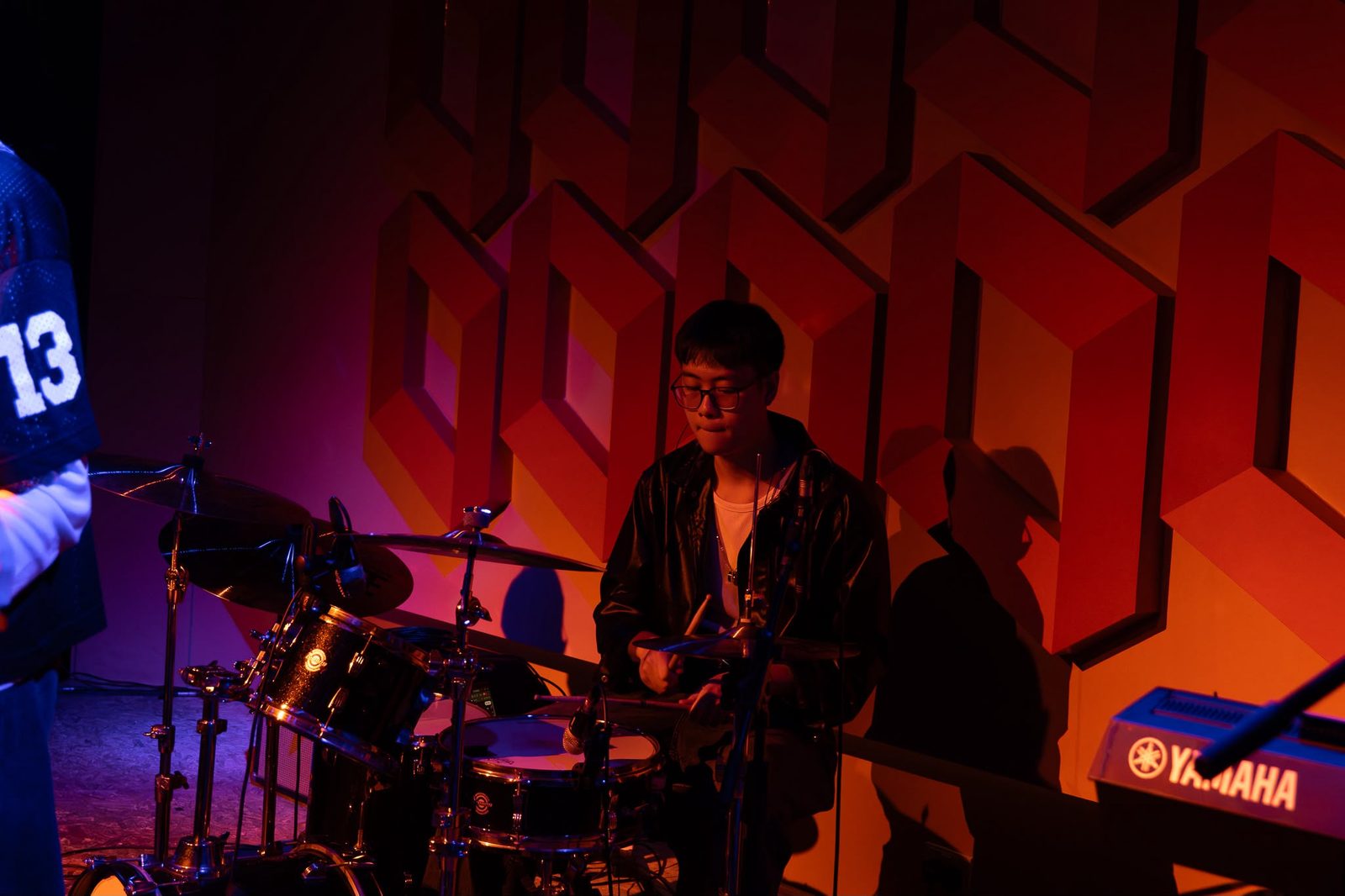 Jorell, beginner-friendly drum teacher near Beauty World, playing live on stage